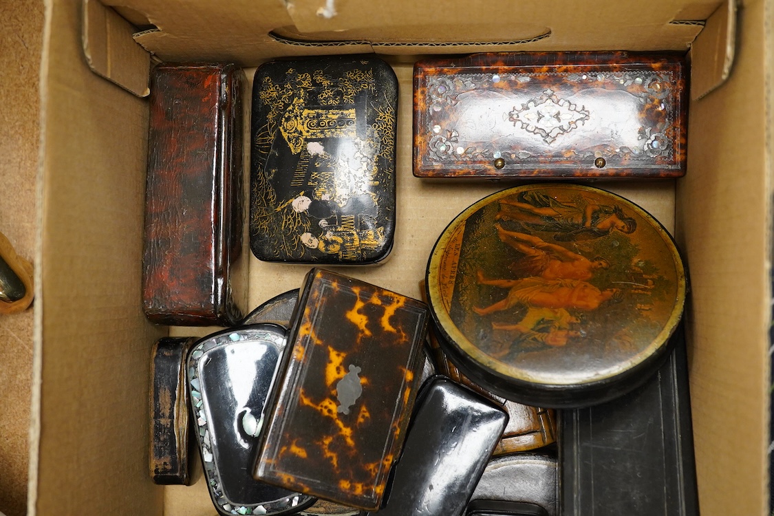 A collection of various snuff boxes to include papier mache examples, two with printed lids and some inlaid examples